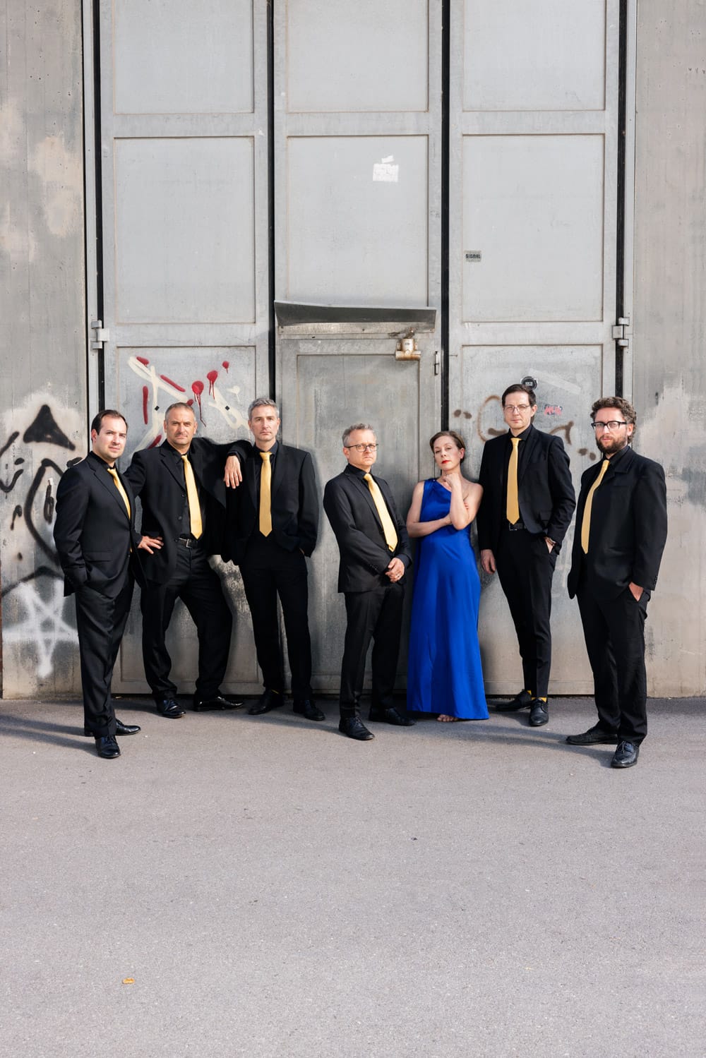 the group in front of a gate